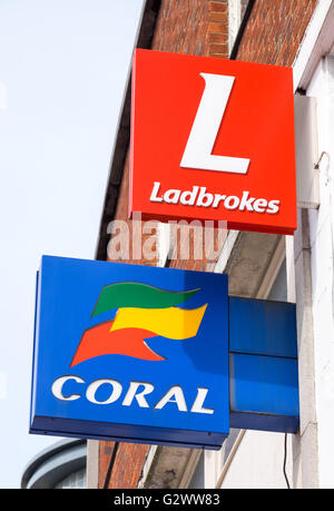 Coral and Ladbrokes betting shop signs next door to each other Stock Photo