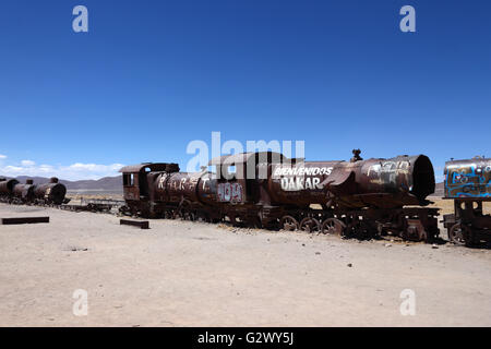 Old steam engine with Welcome Dakar graffiti painted on it, Uyuni train cemetery, Bolivia Stock Photo