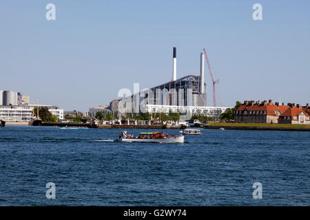 View from Toldboden in Copenhagen Harbour  towards the Amager Slope, CopenHill, and waste-to-energy power plant, designed by Bjarke Ingels, BIG. Stock Photo