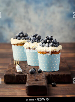 Pumpkin cupcakes, with cream cheese, blueberries Stock Photo
