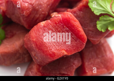 Raw beef goulash as background, top view, soft focus, macro Stock Photo