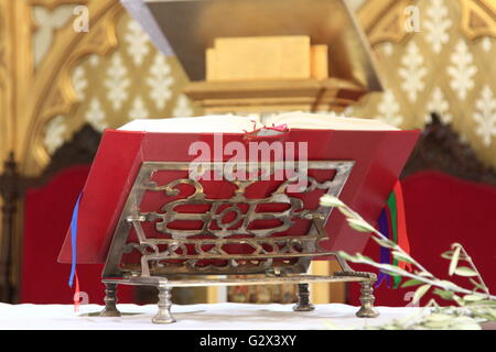 Old lectern with a red book Stock Photo