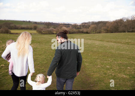 Rear View Of Family On Winter Country Walk Stock Photo