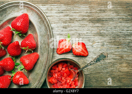 Fresh red strawberries on wooden background close up. Stock Photo