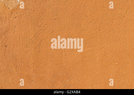 Details of a old concrete wall in orange color Stock Photo