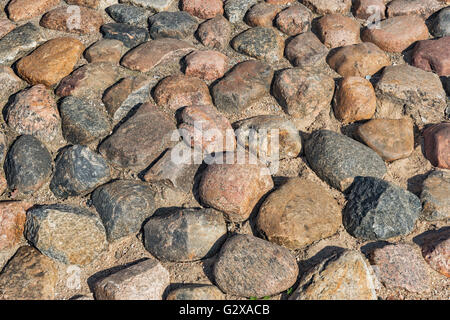 Road with cobblestones in Riga, Latvia, Europe Stock Photo