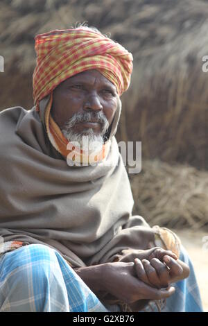 villager in west bengal.the side light,white beard,turban and the hay stack background add beauty to the portrait Stock Photo