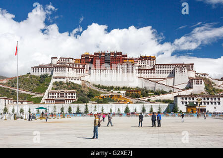 [Editorial Use Only] The majestic Tibetan Potala Palace in Lhasa with tourists in the square at the front Stock Photo