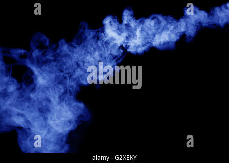 blue smoke on the black background. Stock Photo