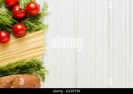 Ingredients for pasta on white wooden table Stock Photo