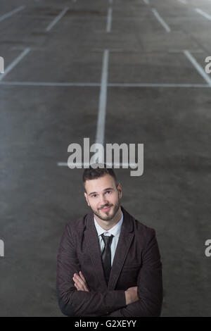 Young fashionable men in fron tof empty space for renting Stock Photo