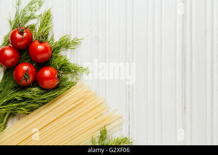 Ingredients for spaghetti on white wooden table Stock Photo