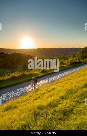 Cyclist on the Zig Zag Box Hill Dorking Surrey Hills sunset Richard Long Stock Photo