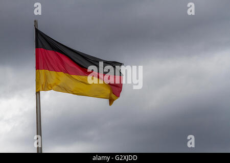 The flag of the Federal Republic of Germany , The German flag is a  tricolour, with three equal horizontal stripes of black, red and gold. Stock Photo