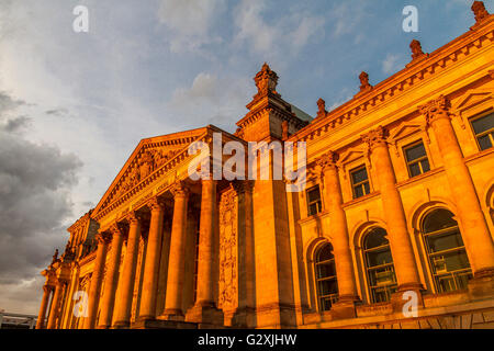 The exterior of the Reichstag building home of the German Parliament ,glowing in the setting sun , Berlin. Germany Stock Photo