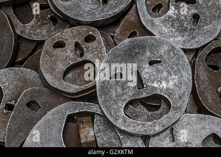 Shalekhet - fallen leaves,installation of metal faces with open mouths, cut from heavy round iron plates covers the floor,in The Jewish Museum Berlin Stock Photo