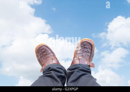 Old shoes brown black pants brown Stock Photo