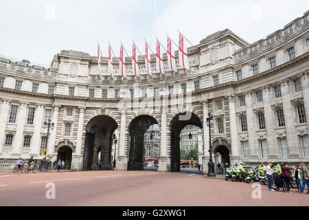 Motorcycle police in front of Admiralty Arch and the Old War Office in the heart of Whitehall, London, UK Stock Photo