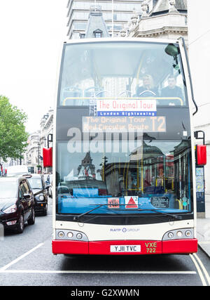 Tourist sightseeing bus in London's Trafalgar Square, UK Stock Photo