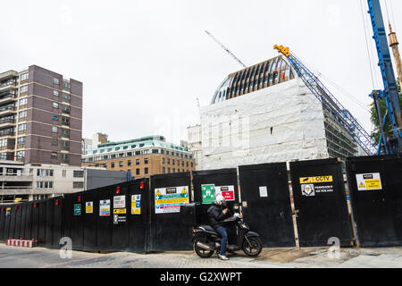 Building and construction work at the junction of St. Martin's Street  and Orange Street in London's Soho, UK Stock Photo