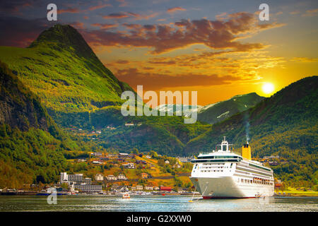 Ferry in Geiranger. bay in the Norwegian mountains. Gold autumn Stock Photo