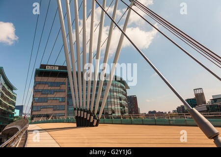The Media City Footbridge is a swing-mechanism asymmetric cable-stayed bridge over the Manchester Ship Canal near MediaCityUK. Stock Photo