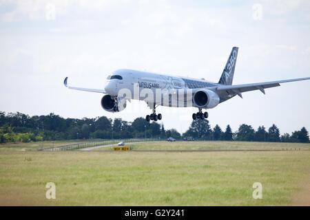 BERLIN / GERMANY - JUNE 3,2016: Airbus A 350 - 900 plane lands on airport in Berlin / Germany on June 3, 2016. Stock Photo