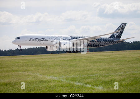 BERLIN / GERMANY - JUNE 3,2016: Airbus A 350 - 900 plane lands on airport in Berlin / Germany on June 3, 2016. Stock Photo