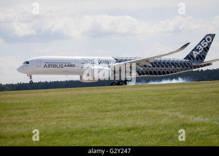 BERLIN / GERMANY - JUNE 3,2016: Airbus A 350 - 900 plane lands on airport in Berlin / Germany on June 3, 2016. Stock Photo