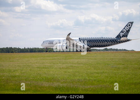 BERLIN / GERMANY - JUNE 3,2016: Airbus A 350 - 900 plane lands on airport in Berlin / Germany on June 3, 2016. Stock Photo