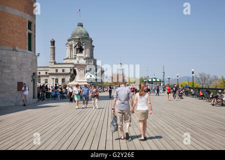 QUEBEC CITY - MAY 23, 2016: The Dufferin Terrace overlooks the St. Lawrence River right by the Château Frontenac. This terrace w Stock Photo