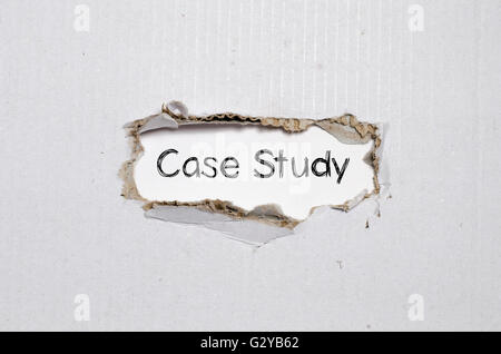 The word case study appearing behind torn paper. Stock Photo