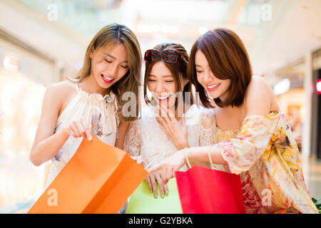 Surprised young women looking the shopping  bags Stock Photo