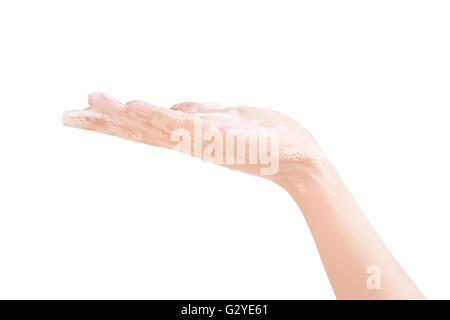 Beautiful female hand in white soap suds isolated on white with clipping path Stock Photo