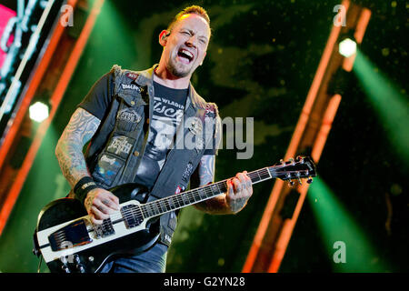 Nuremberg, Germany. 04th June, 2016. Singer and guitarist Michael Poulsen of Danish band Volbeat performs on stage at the 'Rock im Park' (Rock in the Park) music festival in Nuremberg, Germany, 04 June 2016. More than 80 bands are set to perform at the festival until 05 June. Photo: DANIEL KARMANN/dpa/Alamy Live News Stock Photo