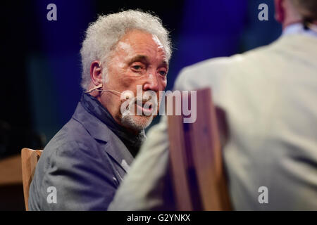 Hay Festival 2016, Hay on Wye, Powys , Wales UK  Sunday June 05 2016  Sir Tom Jones, speaking in public for the first time since the death of his wife, talking about his new autobiogrpahy on the final day of the 2016 Hay Festival of Literature and the Arts  For ten days in late May and early June  the small town of Hay on Wye on the  Wales-England border becomes the 'Woodstock of the Mind', and attracts some of the worlds best writers, novelists and poets   photo Credit:  Keith Morris / Alamy Live News Stock Photo