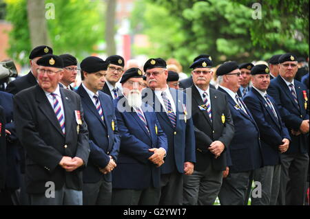 London Ontario Canada, Sunday 05 June 2016.  Past and present members of the Canadian First Hussars march through London and participate in a ceremony to mark the 72nd anniversary of the D-Day landings and the 160th anniversary of the First Hussars. The ceremony was held in Victoria Park near a preserved Sherman Tank which was used by the First Hussars in Europe during the Second World War. Stock Photo