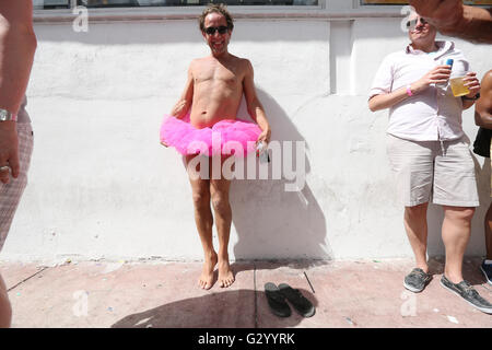 Man wearing tutu on sidewalk near Ocean Drive in Miami Beach, Florida. Stock Photo