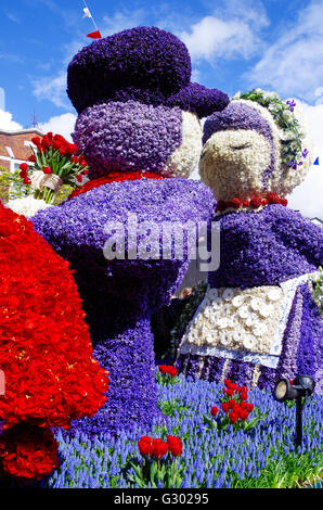 Flower parade float and flower sculptures in the annual Holland flower parade. 2016 topic was Mode and Flowers. Stock Photo