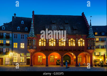 Historical department store at Münsterplatz, dusk, Freiburg im Breisgau, Black Forest, Baden-Württemberg, Germany Stock Photo