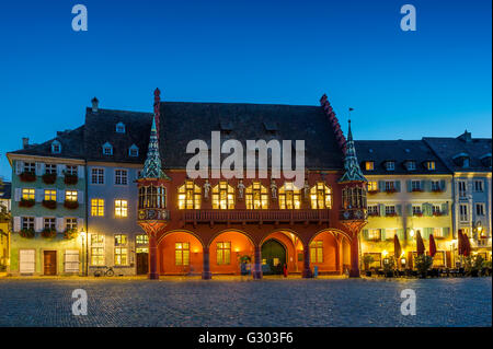 Historical department store at Münsterplatz, dusk, Freiburg im Breisgau, Black Forest, Baden-Württemberg, Germany Stock Photo