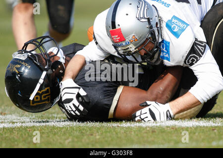 American football, Zacchaeus McCaskill, No. 3 Rangers, is tackled by LB Julian Hackl, No. 34 Raiders, Kornmesser Rangers vs. Stock Photo