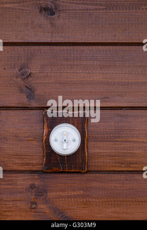 Retro light switch on wooden background Stock Photo