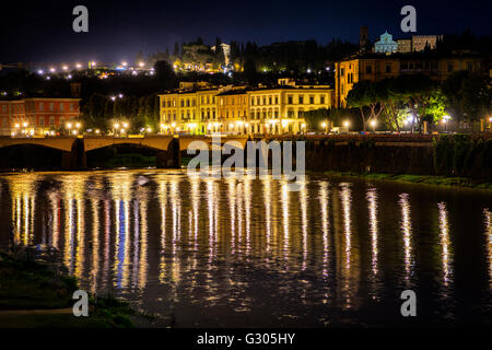 Ponte Vecchio and Arno river in Florence. Historical view of Italy at night Stock Photo