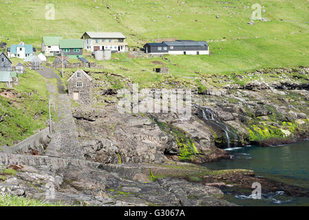 Typical landscape on the Faroe Islands, with the village Hattarvik Stock Photo
