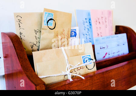 Letter rack from the early 1900s with a selection of letters and telegrams. Stock Photo