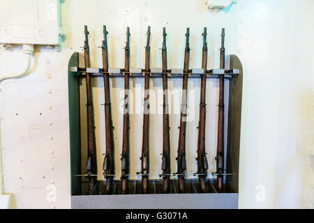 Rack of .303 (7.7mm) WW1 rifles on HMS Caroline, Belfast, the last surviving ship from the Battle of Jutland. Stock Photo