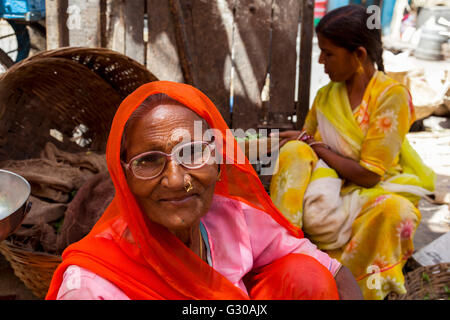 Two ladies in traditional dress in a street market in the city of Udaipur, Rajasthan, India, Asia Stock Photo