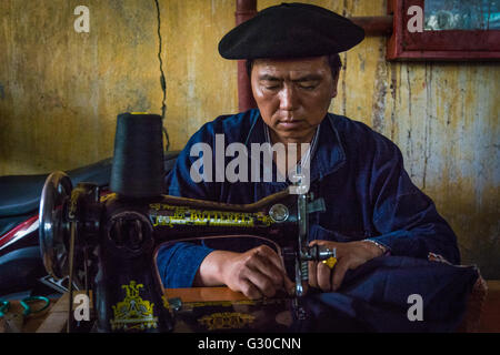 Tailor sewing clothing at the Meo Vac Market, Meo Vac, Ha Giang Province, Vietnam. Stock Photo