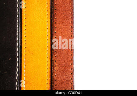 Leather belt arranged on a white backgrounds. Stock Photo